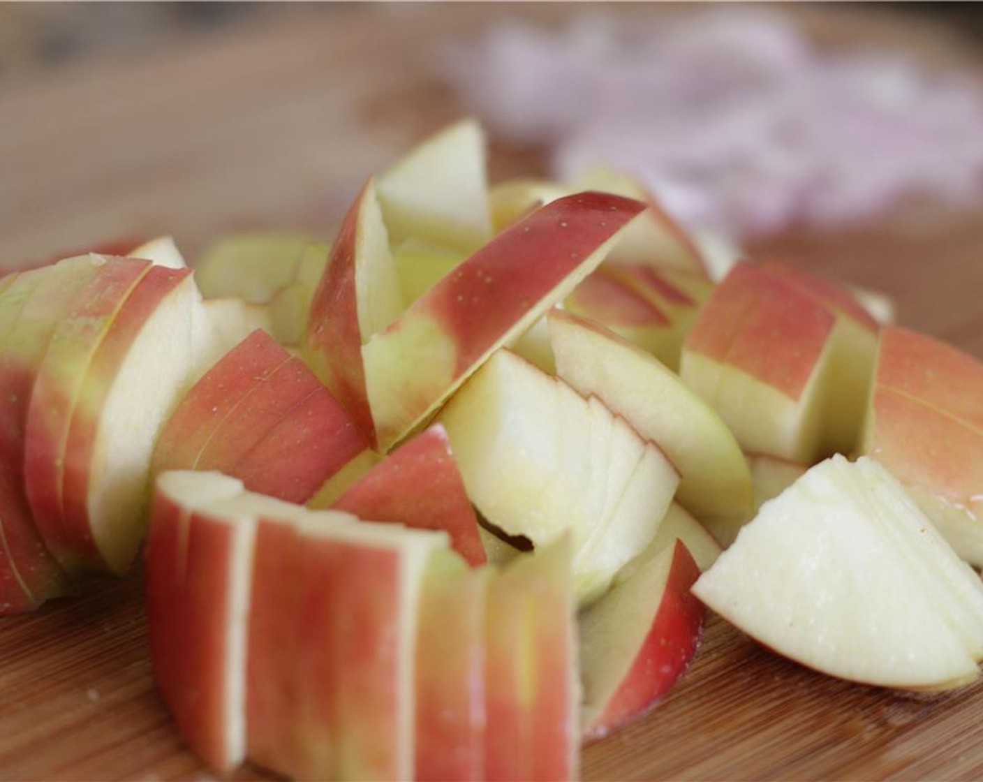 step 11 Chop the Honeycrisp Apple (1) bite-sized pieces and add it to the kale.