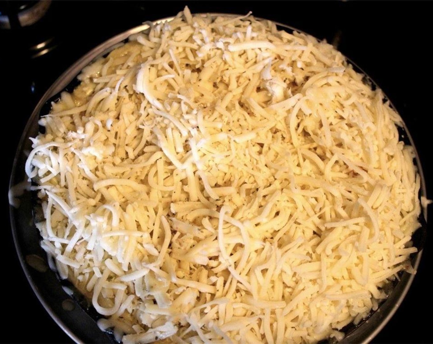 step 6 Place skillet in the oven and bake for approximately 30 minutes, until the cheese is golden.