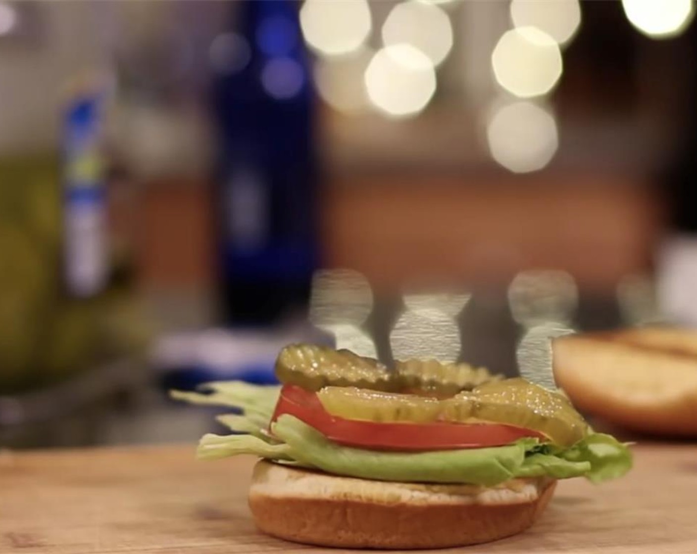 step 5 We decided to layer our burger with Iceberg Lettuce (1 head) first as a barrier to all the grease. Then a layer of Tomato (1), sliced Dill Pickles (to taste), American Cheese Slices (6) and all six mustard grilled cheeseburgers.