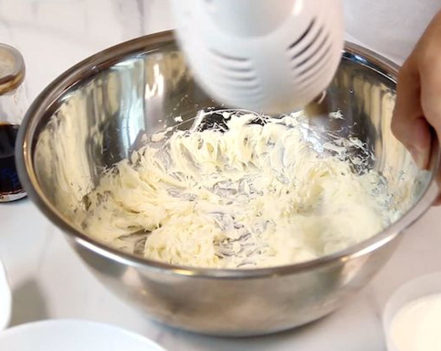 step 1 Beat Cream Cheese (1/2 cup) with a hand mixer until it is spread out. Then, scatter in Caster Sugar (1/2 cup) and whip until it is nicely combined.