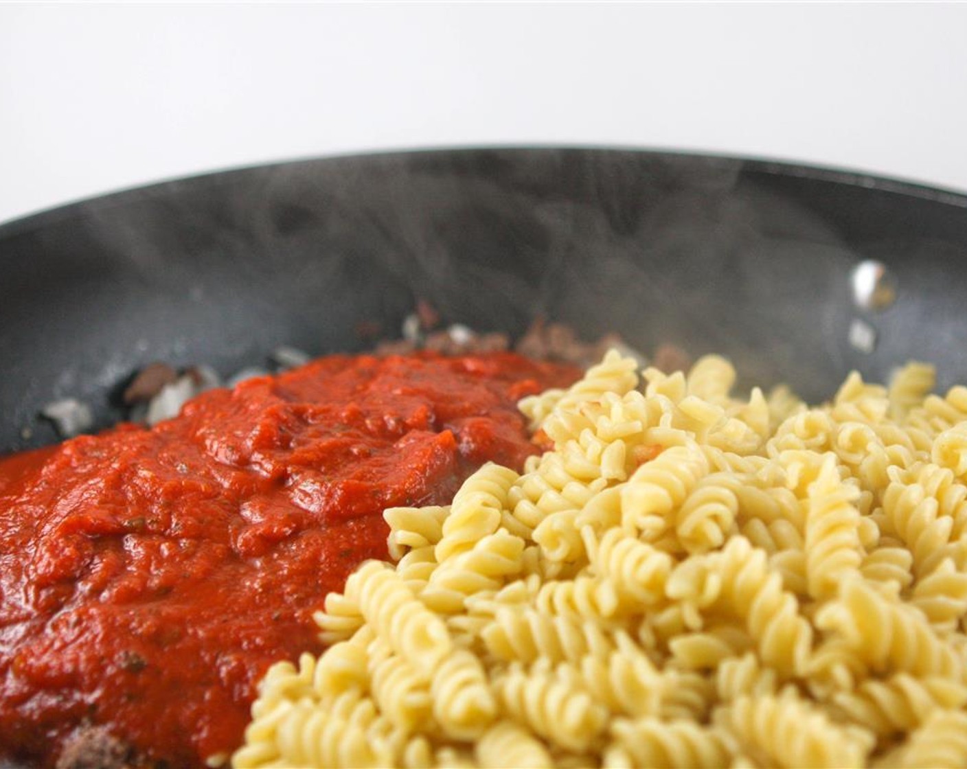 step 5 Add Salt (to taste) and Ground Black Pepper (to taste), along with the Pasta Sauce (1 jar) and cooked pasta. Cook until sauce is warm, about 5 additional minutes.