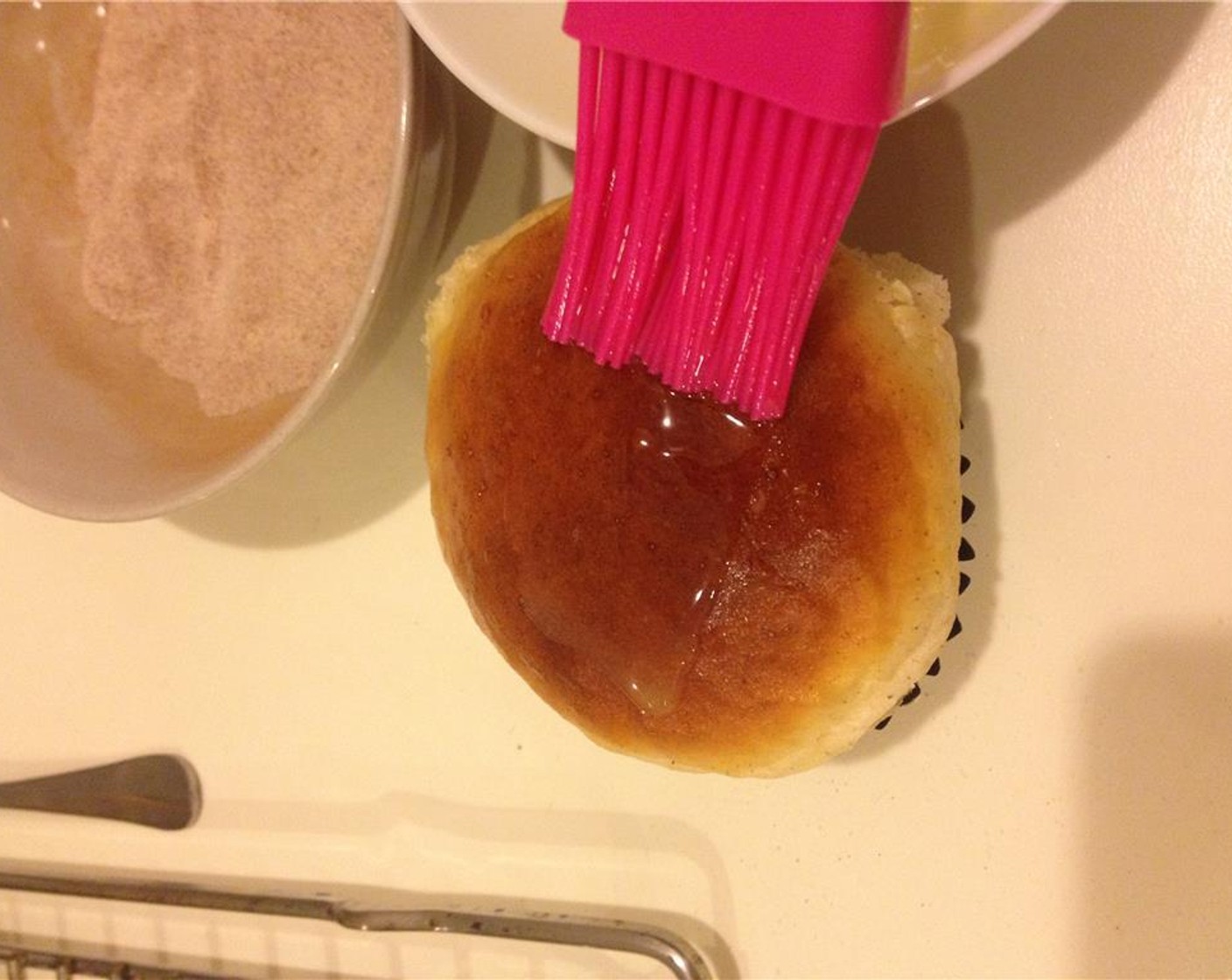 step 19 Transfer the baked buns to a rack and let them cool. Once the buns have cooled down, brush a thin layer of melted Unsalted Butter (1 1/2 Tbsp) on top.