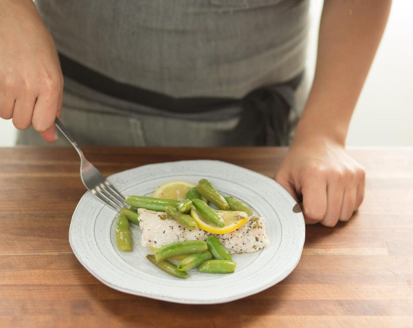 step 12 In the center of two plates, place the mahi-mahi with sugar snap peas and caper butter. Serve and enjoy!