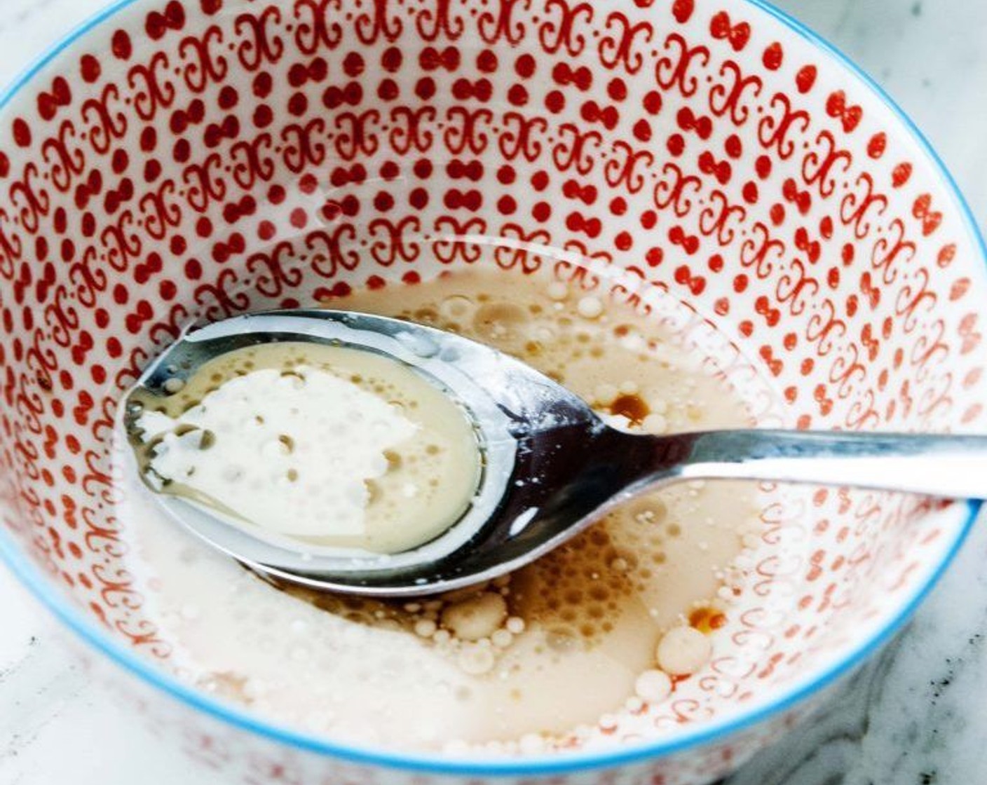 step 3 In a bowl stir together Coconut Oil (1/4 cup), Almond Milk (3 Tbsp), Maple Syrup (2 Tbsp), and Vanilla Extract (1 tsp).