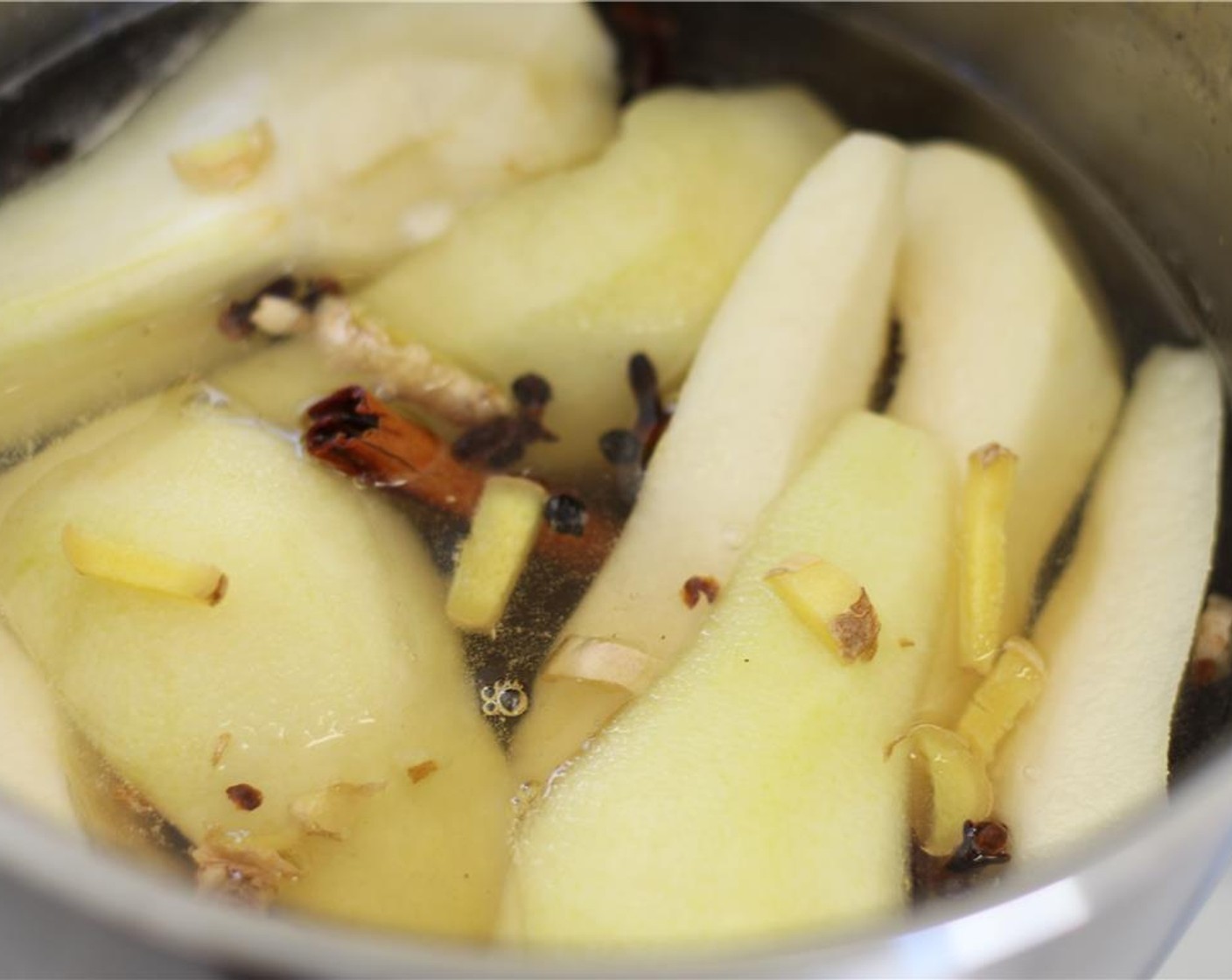 step 3 When syrup is boiling, add pears. Reduce heat and let simmer for 15-20 minutes or until pears are soft when run through with a knife.
