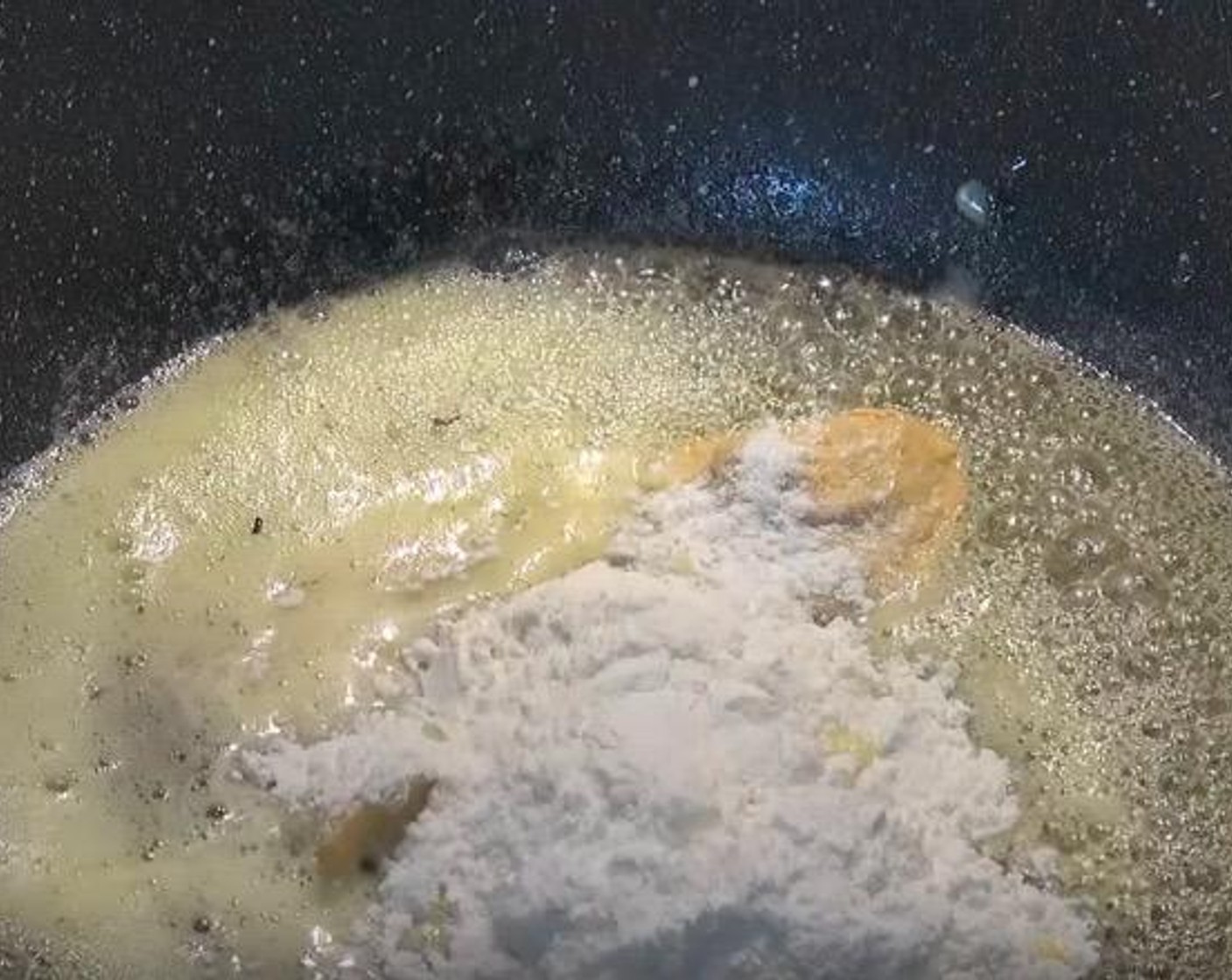 step 3 In a large pan, add Butter (1/4 cup). Once butter is melted, add in Dijon Mustard (1 tsp) and All-Purpose Flour (1/4 cup). Whisk together until it becomes a smooth paste.