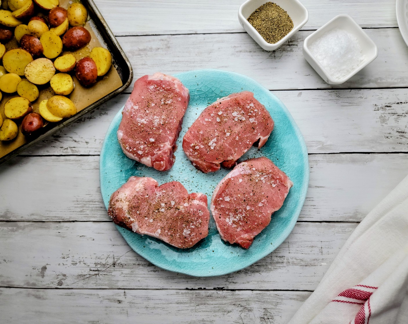 step 4 Season the Boneless Pork Chops (2 lb) all over with Kosher Salt (1/2 Tbsp) and Ground Black Pepper (1 tsp).