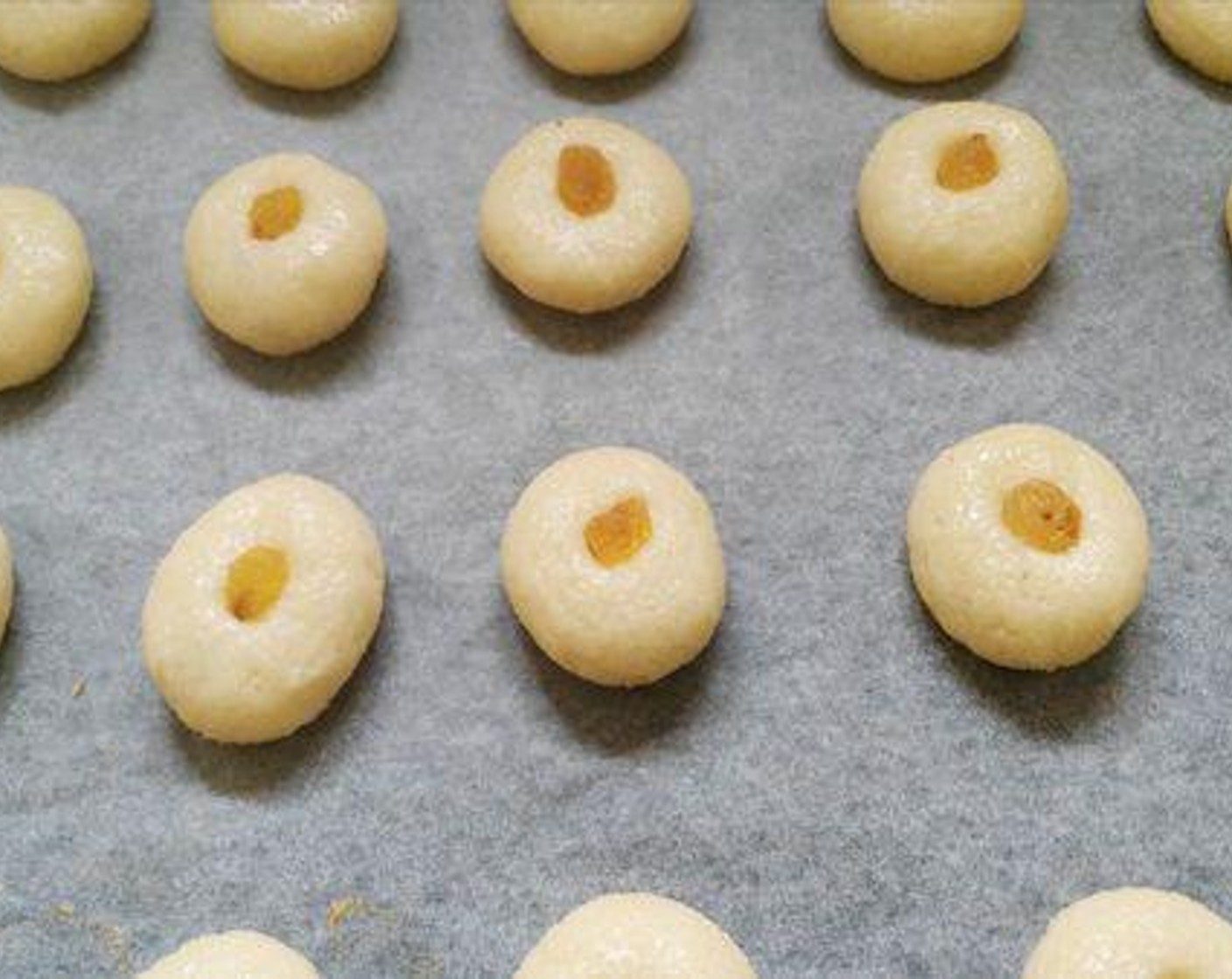 step 4 Arrange the cookies on a baking tray and place Sun-Maid Raisins (to taste) on each cookie ball and bake for about 8 to 10 minutes.