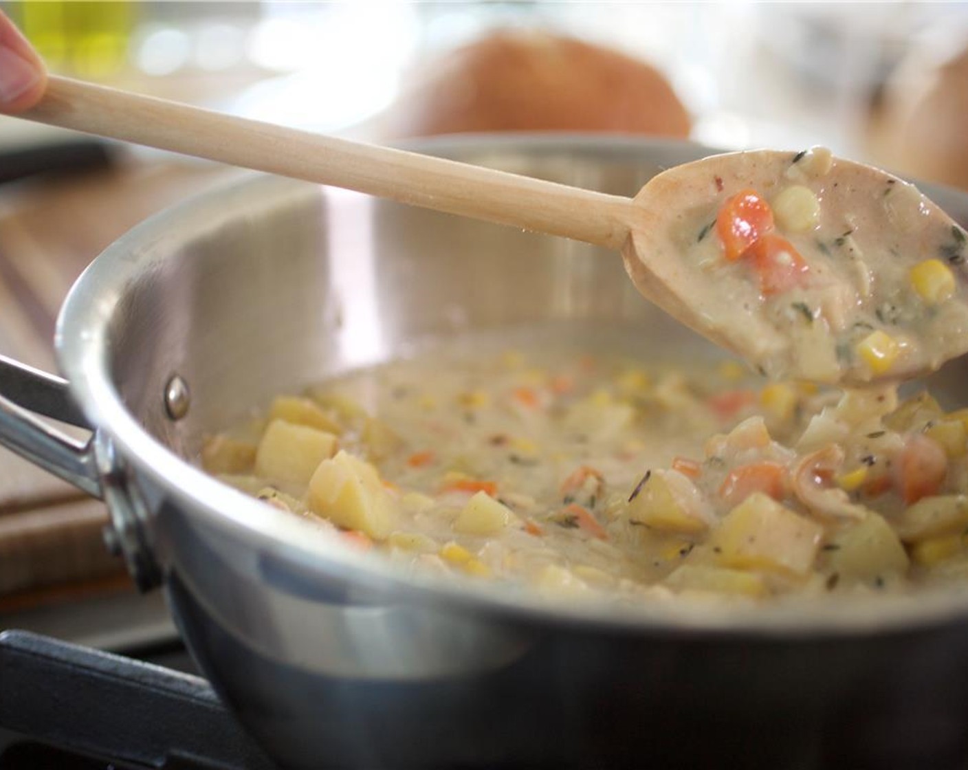 step 11 While stirring, pour the clam juice into the mixture in a steady stream until fully blended and no lumps remain. Reduce the heat to low and simmer for 14 minutes, until the chowder starts to thicken.