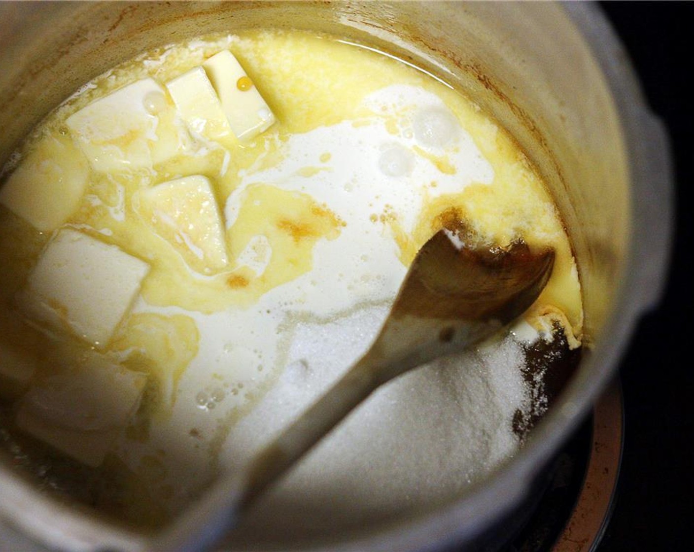 step 4 Remove the pot from the heat and stir in Unsalted Butter (1/2 cup), Granulated Sugar (1 cup), Maple Syrup (1/2 cup), and Heavy Cream (1/3 cup). Attach a candy thermometer to the side of the pot and return to the heat.