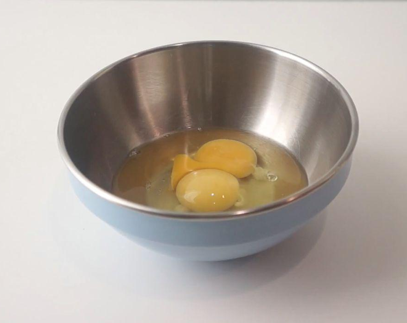 step 1 In a bowl, beat the Eggs (2) and add the Baking Powder (1 tsp) and combine.