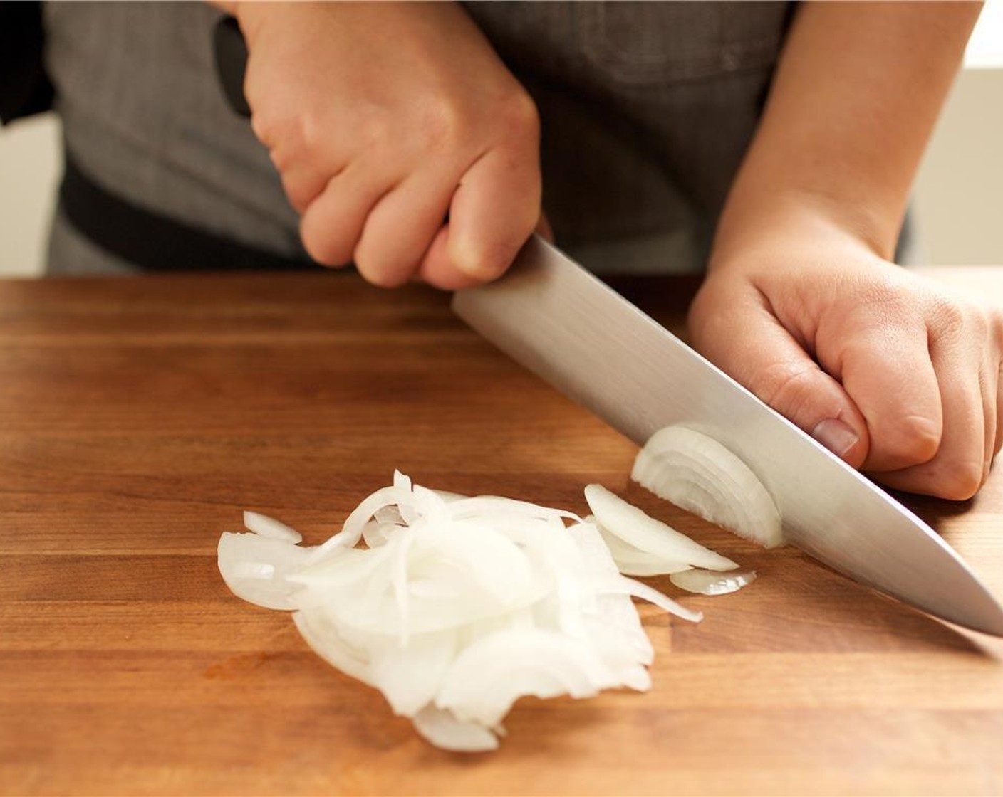 step 1 Peel and cut Onion (1/4) in half. Using a quarter of the onion, cut into quarter inch slices, and set aside.