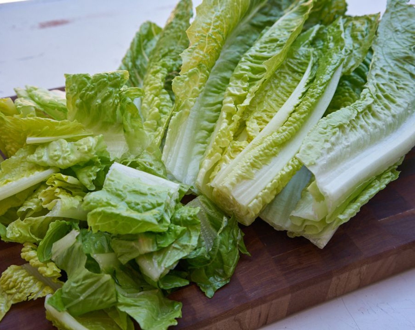 step 2 Chop Romaine Lettuce (2 heads) into wide ribbons.