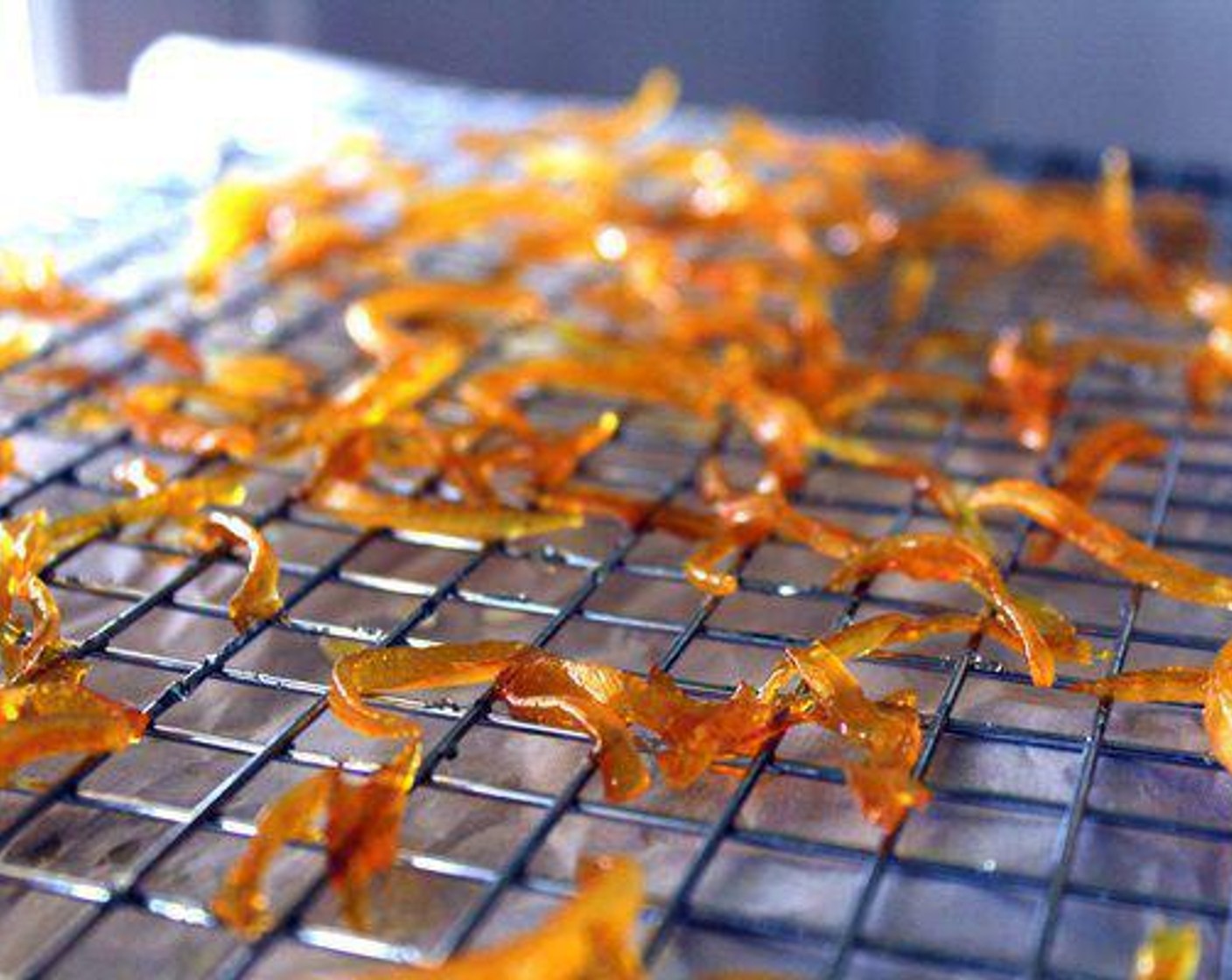 step 6 Very carefully remove the peel from the sugar mixture and place on the rack. Use a fork to separate the pieces, then let cool for 1 to 2 hours.