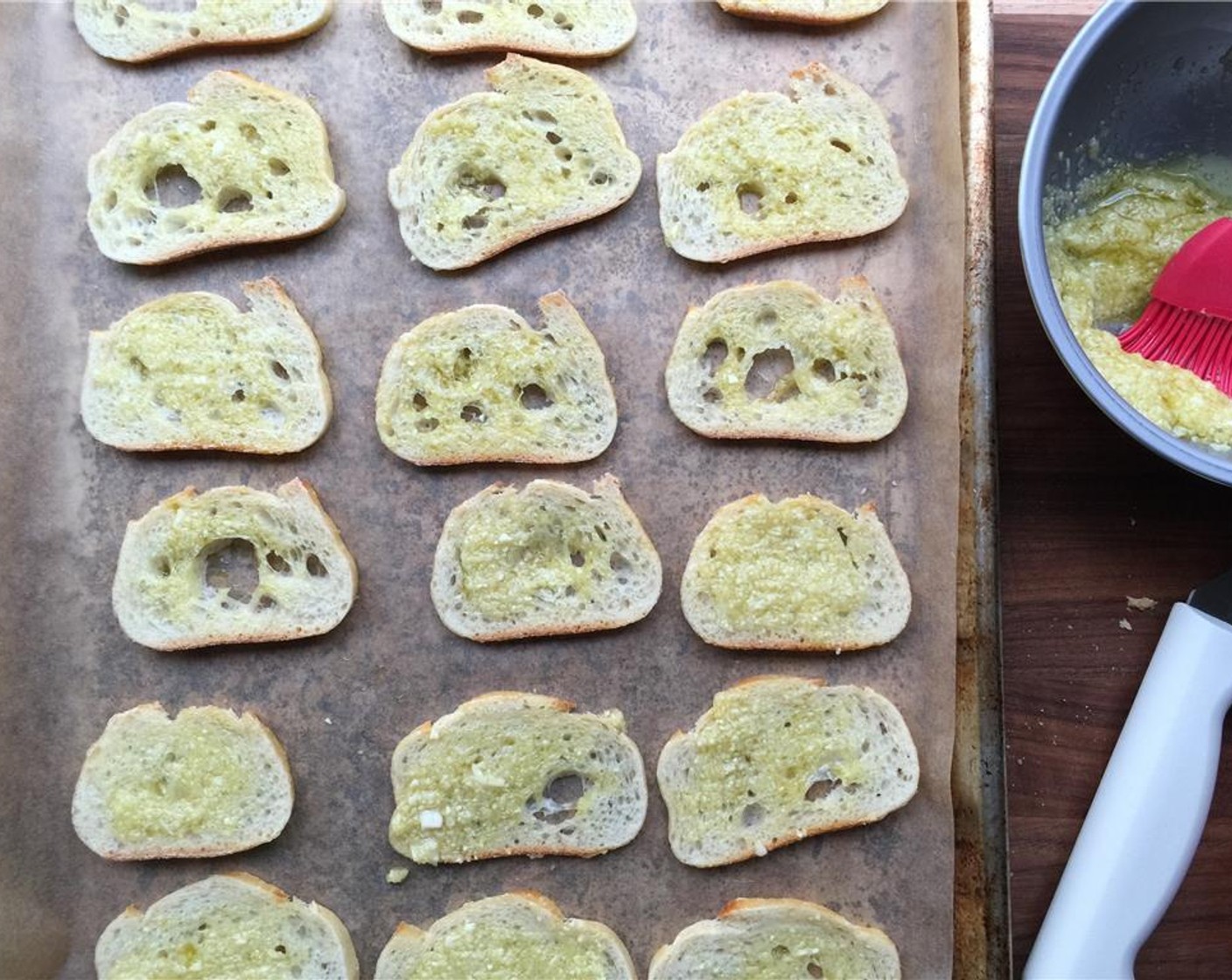 step 11 Brush the Baguette (1) slices with the garlic olive oil and bake in the preheated oven until golden brown, 12-15 minutes.