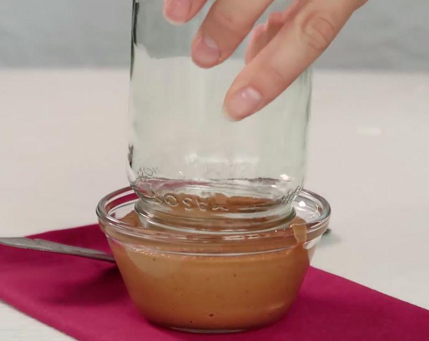 step 2 Spread 2-3 tbsp peanut butter around the rim of a glass or mason jar.
