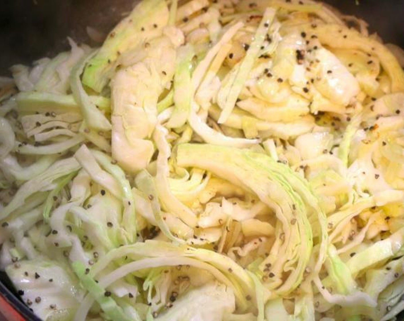 step 3 Add Green Cabbage (1 head), then season with Chili Paste (1 Tbsp), Sesame Oil (1 Tbsp), Hoisin Sauce (1 Tbsp), Ground Black Pepper (1 tsp) and Kosher Salt (to taste). Saute until the cabbage starts to soften.