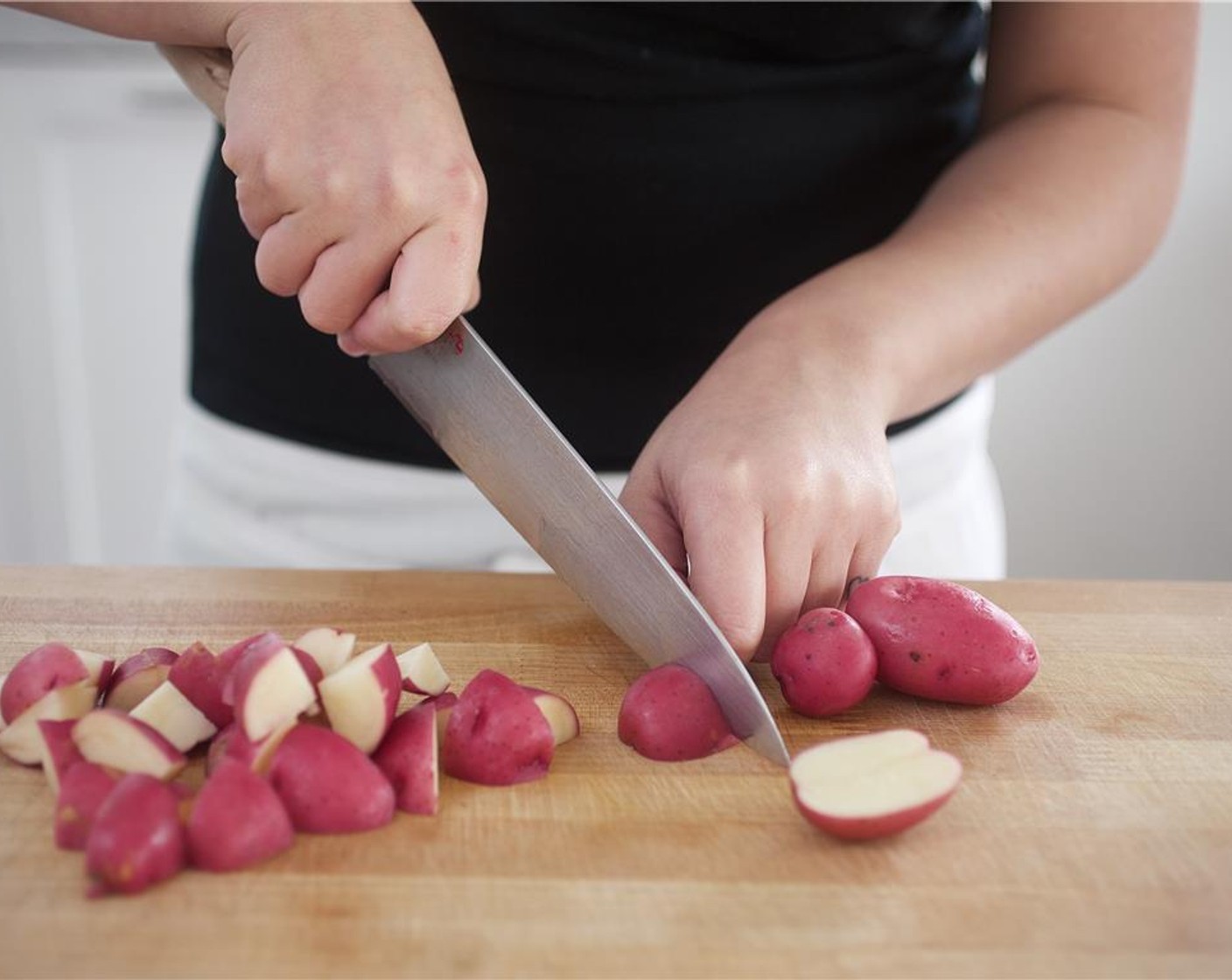 step 1 Bring eight cups of water to a boil in a large saucepan. Thinly slice 2 of the Garlic (2 cloves) into quarter inch slices, and set aside. Cut the Red Creamer Potatoes (1 1/2 cups) in half, then cut each half into four pieces.