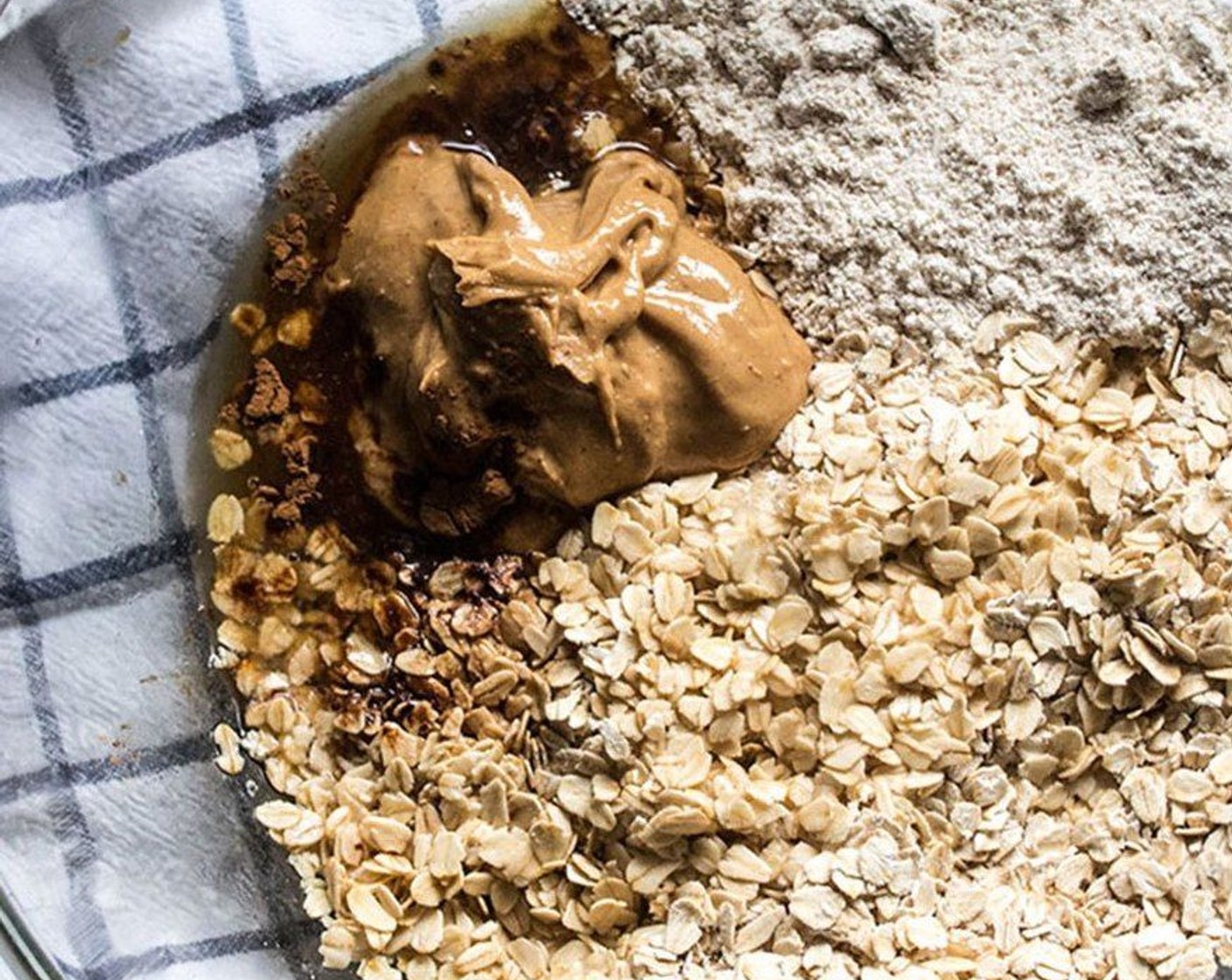step 2 Add Oats (3 cups), Oat Flour (1/2 cup), Peanut Butter (1/2 cup), Raw Honey (4 Tbsp), Unrefined Coconut Oil (3 Tbsp), Maple Syrup (2 Tbsp), Vanilla Extract (1 tsp), and Simply Organic Cinnamon, Ground (1/8 tsp) to large bowl. Stir thoroughly until mixture is well combined.