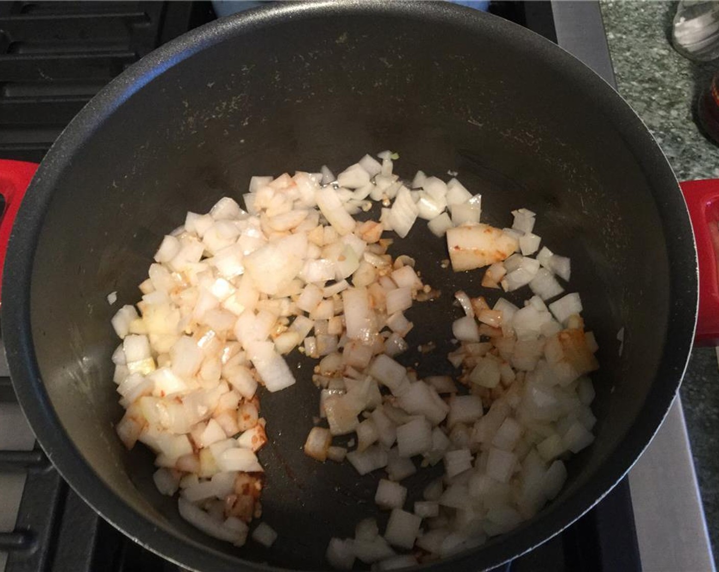 step 8 Heat Vegetable Oil (1 splash) in a pot and fry the onions and garlic until brown.