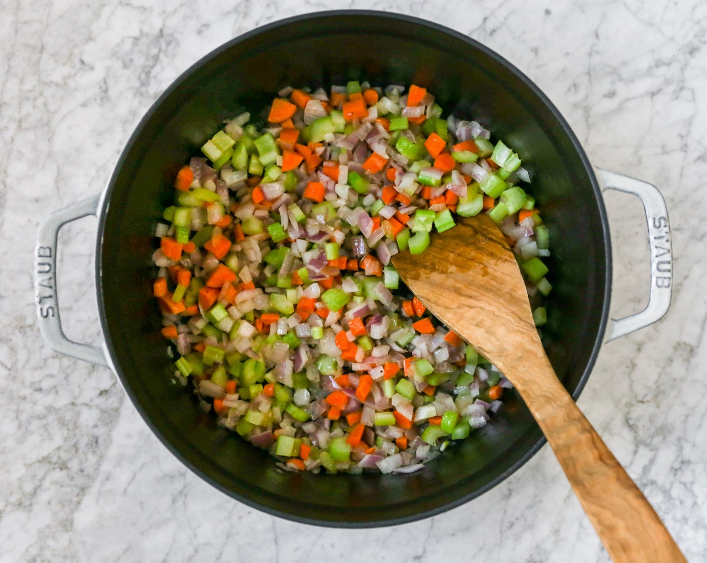 step 2 Add the Red Onion (1), Celery (4 stalks), Carrot (1), Salt (to taste) and Ground Black Pepper (to taste). Stir together and allow to sauteé for about 8 minutes, until the onions are translucent and the carrots are softened.