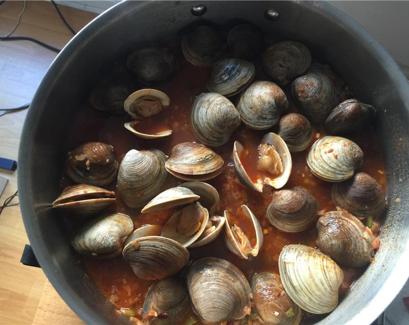 step 12 Cover and cook 5 to 8 minutes until the clams have opened.