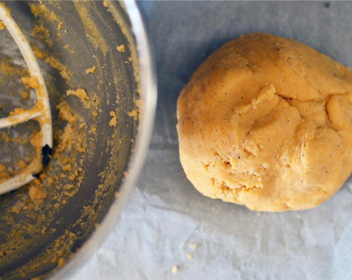 step 3 With mixer on low, beat in flour mixture and continue to beat until dough forms into a ball. Dump dough onto a lightly floured surface and knead a few times to form into a uniformed dough ball.