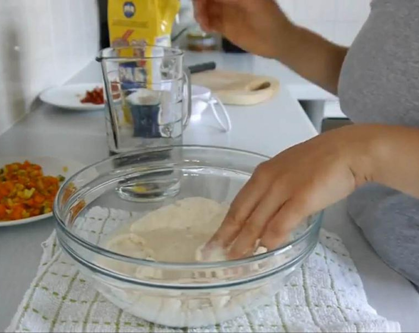 step 3 In a bowl add the Corn Flour (2 cups), Water (1 1/2 cups), and Salt (1 Tbsp) and mix well with your hands to avoid lumps.