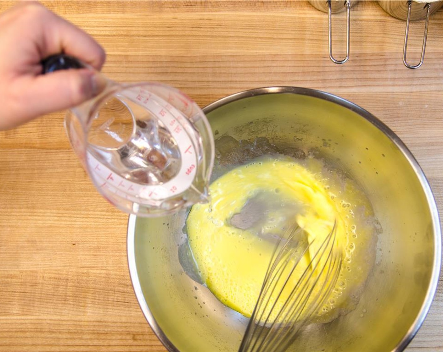 step 4 Whisk Water (1 cup) into yolks.