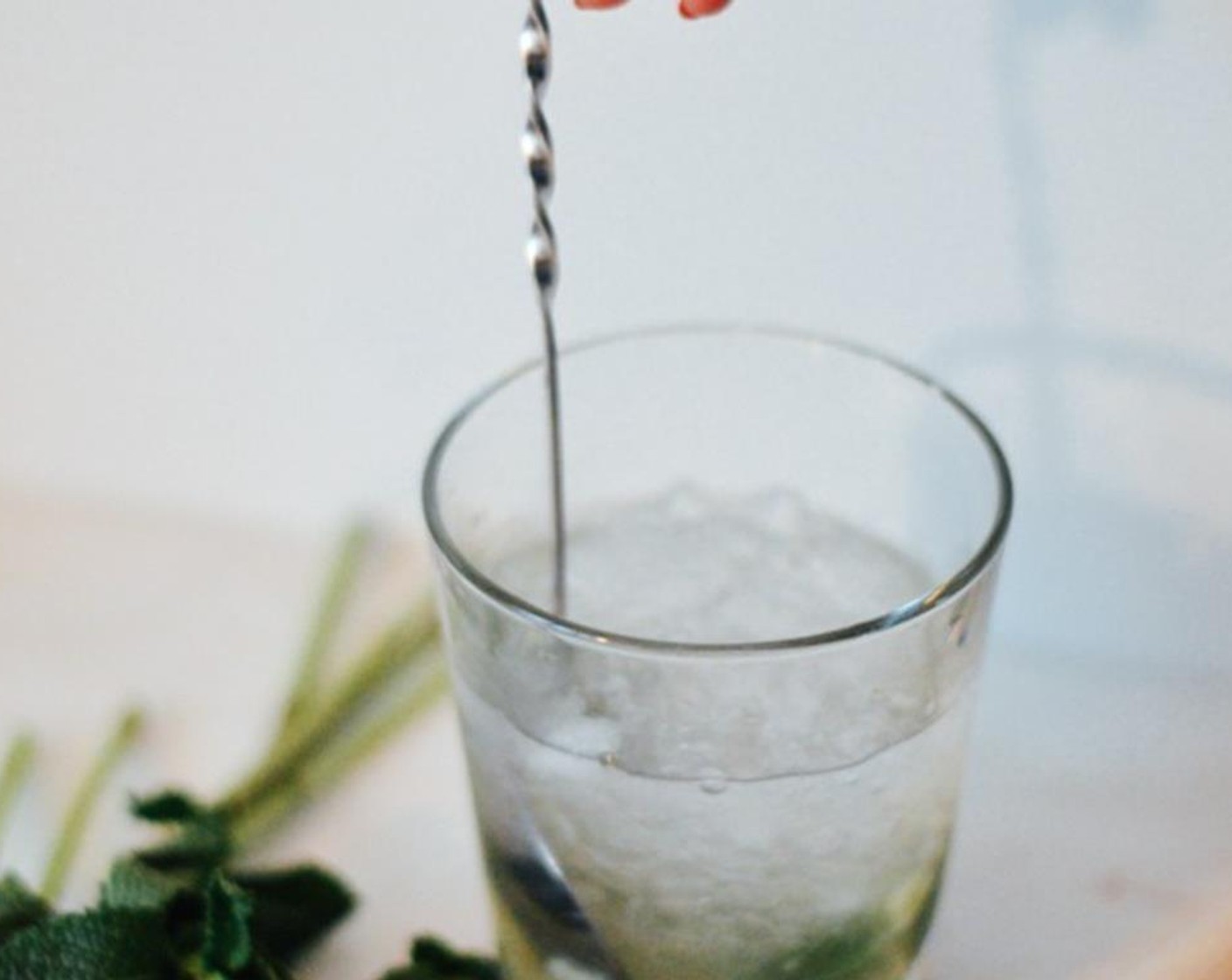 step 2 Add White Mezcal (1.5 fl oz) and a quarter cup of crushed ice, stir.