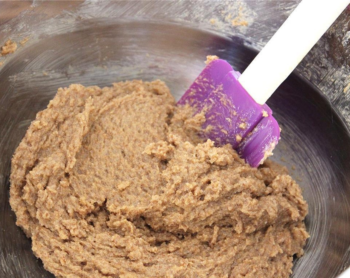 step 2 In a larger bowl, add the Vegetable Shortening (1/2 cup), Vegan Margarine (1/2 cup), Granulated Sugar (1/2 cup), Brown Sugar (1/2 cup), Vanilla Extract (1 tsp), and Unsweetened Apple Sauce (1/4 cup) together. Beat until everything is well mixed.