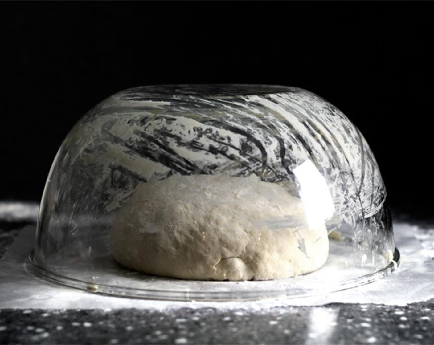 step 8 Cover with a large bowl on top and let proof again for 1 to 2 hours. 45 minutes before the dough's ready, preheat the oven on 450 degrees F (230 degrees C) with a large dutch oven, or a heavy-bottom pot (both should come with lid) inside.