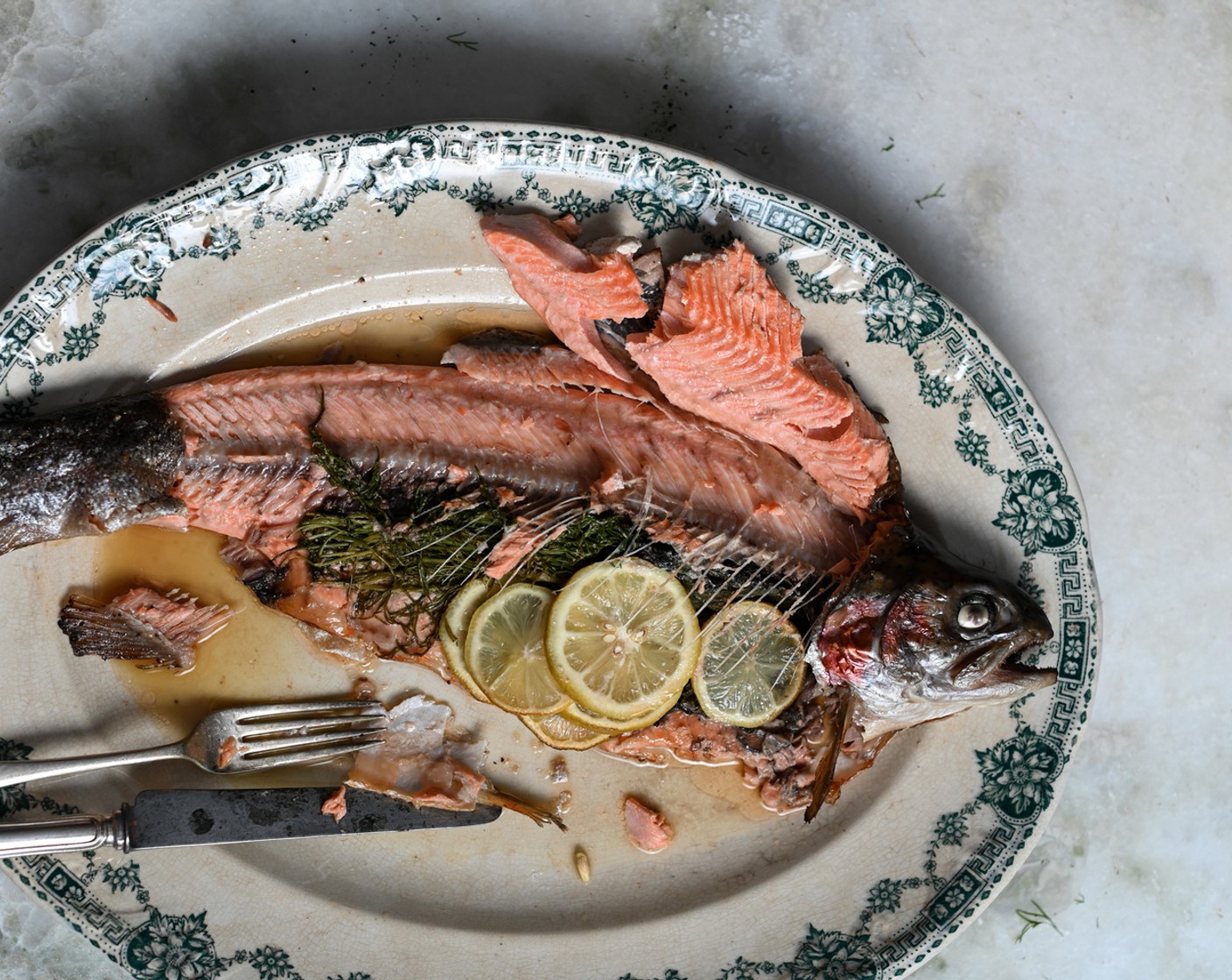 step 5 Butterfly the fish open and remove the spine, head, and tail. Discard the aromatics and flake the fillets, taking care to remove any bones. Set aside the flaked fish until needed.