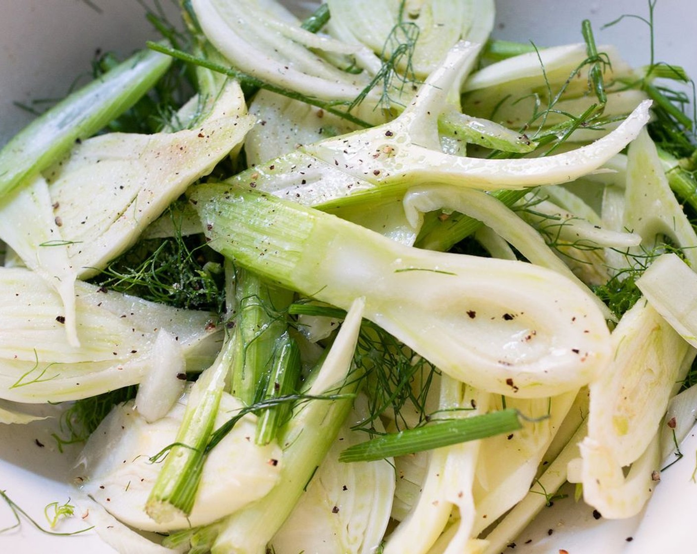 step 2 In a large bowl mix the Fennel Bulbs (2) with the Olive Oil (2 Tbsp), a pinch of zest from the Lemon (1), 2 tablespoons of lemon juice, Fresh Parsley (1 handful), Garlic (1 clove), Salt (1/2 tsp), and Freshly Ground Black Pepper (1 pinch).