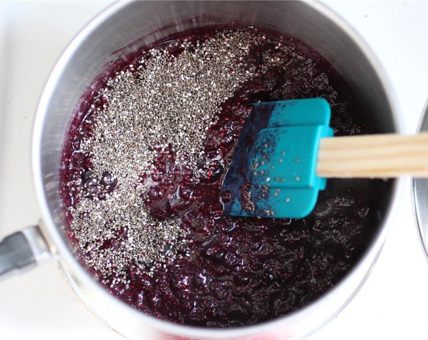 step 4 Stir in Agave Syrup (1/2 Tbsp). Add Chia Seeds (2 1/2 Tbsp), stir, then remove from heat. The chia seeds give the jam a bit of a seed feel, so if you don’t like that (think raspberry jam consistency), you could also blend the jam to make it a bit more jelly-like.