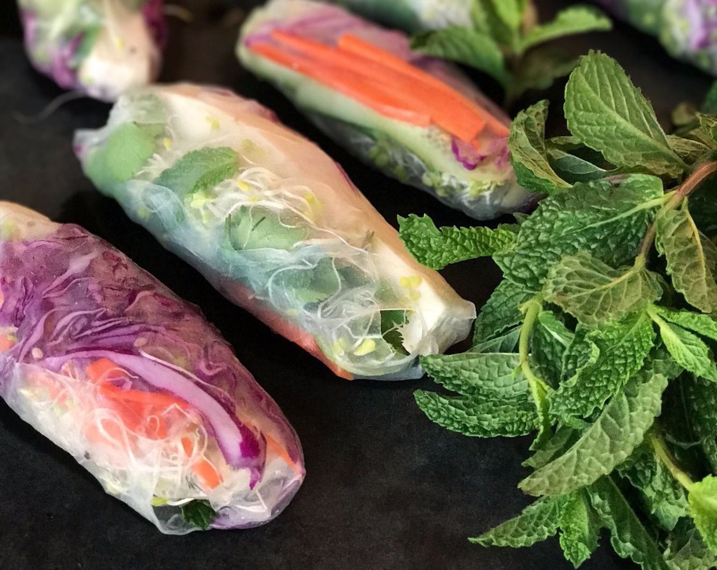 step 5 Spring Rolls: Pour water into a shallow dish and dip the Rice Paper Wrappers (16) for 2-3 seconds per side. Transfer to a damp cutting board. Add tofu, Alfalfa Sprouts (3/4 cup), carrots, cucumber, red cabbage, Fresh Cilantro (1 bunch), Fresh Mint (1 bunch) and Lettuce (to taste) to your liking. They don't all need to be the same. Gently roll like a burrito. Cover with a damp towel to keep fresh.​ Enjoy!