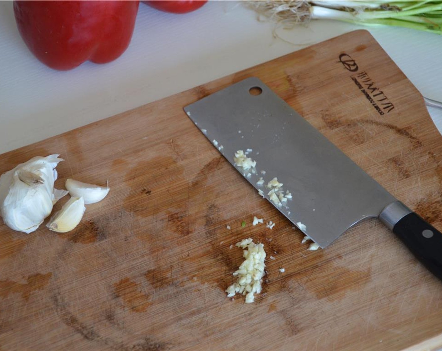 step 1 Mince the Garlic (1 clove) and Scallion (1 bunch).