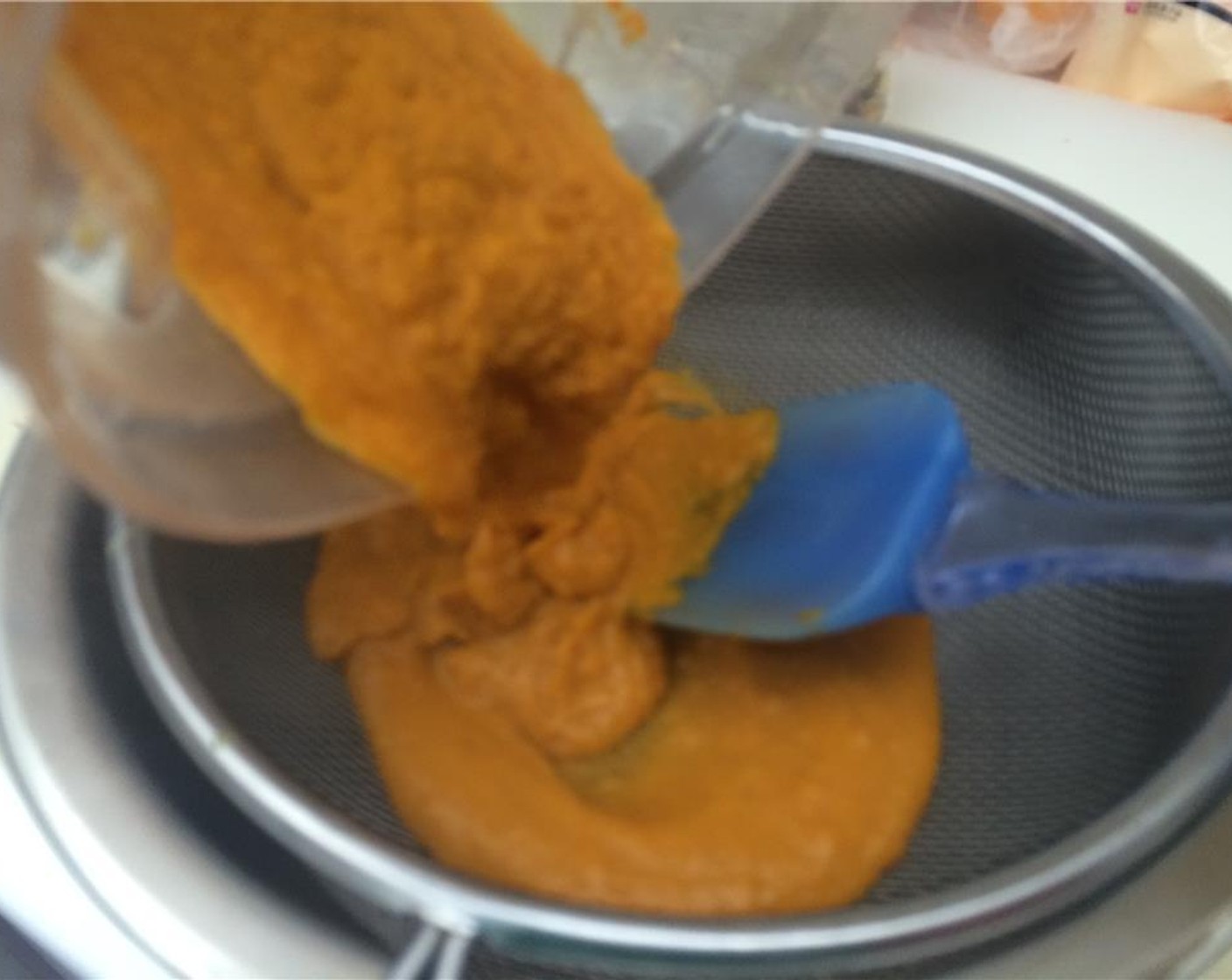 step 8 Then blend the squash mixture in a blender or food processor, while slowly drizzling in Olive Oil (as needed) until completely smooth. Strain the butternut squash puree through a fine-mesh strainer (chinois mousseline) and set aside.