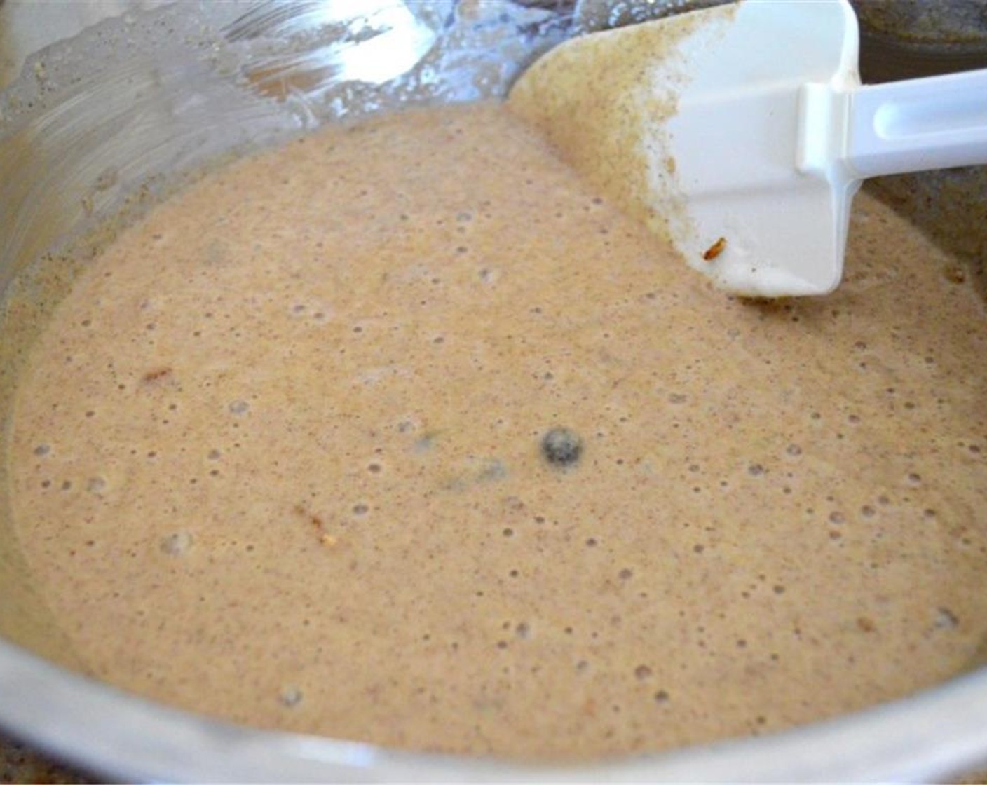 step 5 Switch to a rubber spatula and fold the egg whites and Granola (1 cup) into the batter.