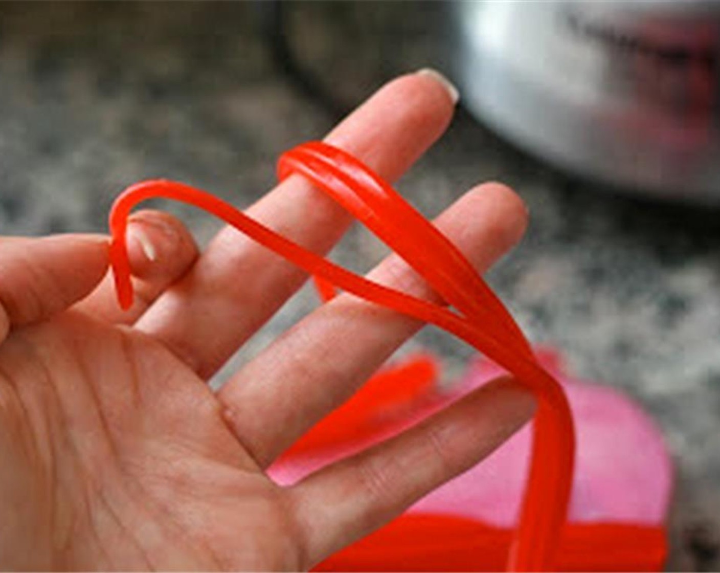 step 4 Gently remove your "baseballs" and arrange on a platter. Cut curved slits on each side of the "baseball" to mimic the stitching lines. Separate licorice from TWIZZLERS® Pull 'n' Peel (1 handful) into individual ropes, and cut into small pieces.