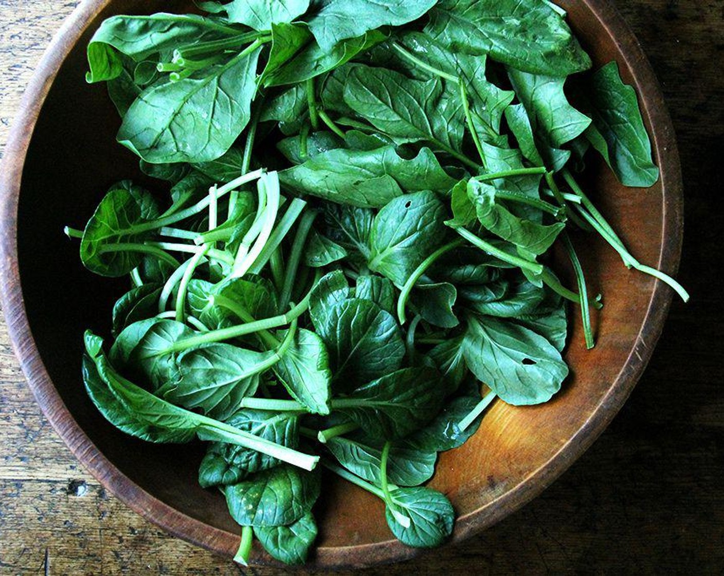 step 2 Meanwhile, transfer Fresh Spinach (1 lb) to a colander to drain—it's OK if some of the water clings to the greens.