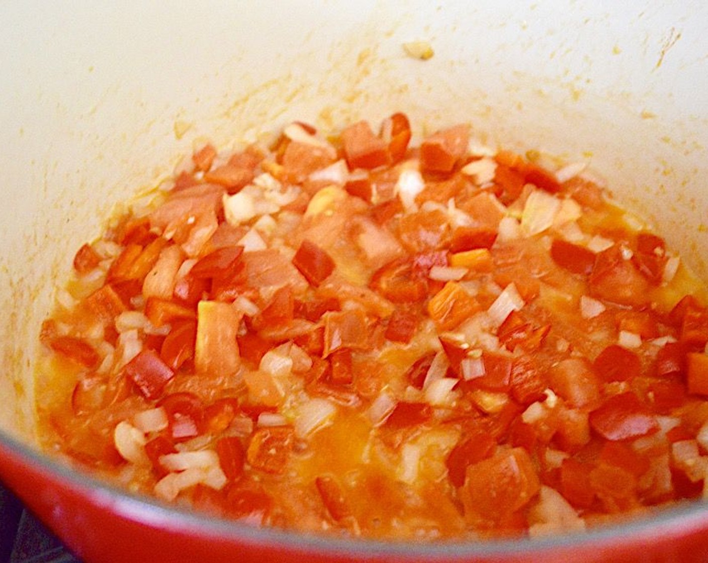 step 3 Add the Red Bell Peppers (2), Onion (1), Garlic (4 cloves), and Beefsteak Tomato (1) to the pan. Let them get fragrant and translucent for a couple of minutes.