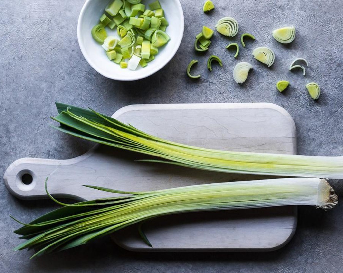 step 1 Slice the Leeks (2) lengthwise in half, remove a couple of layers of the outer leaves so that you are left with the tender center leaves.