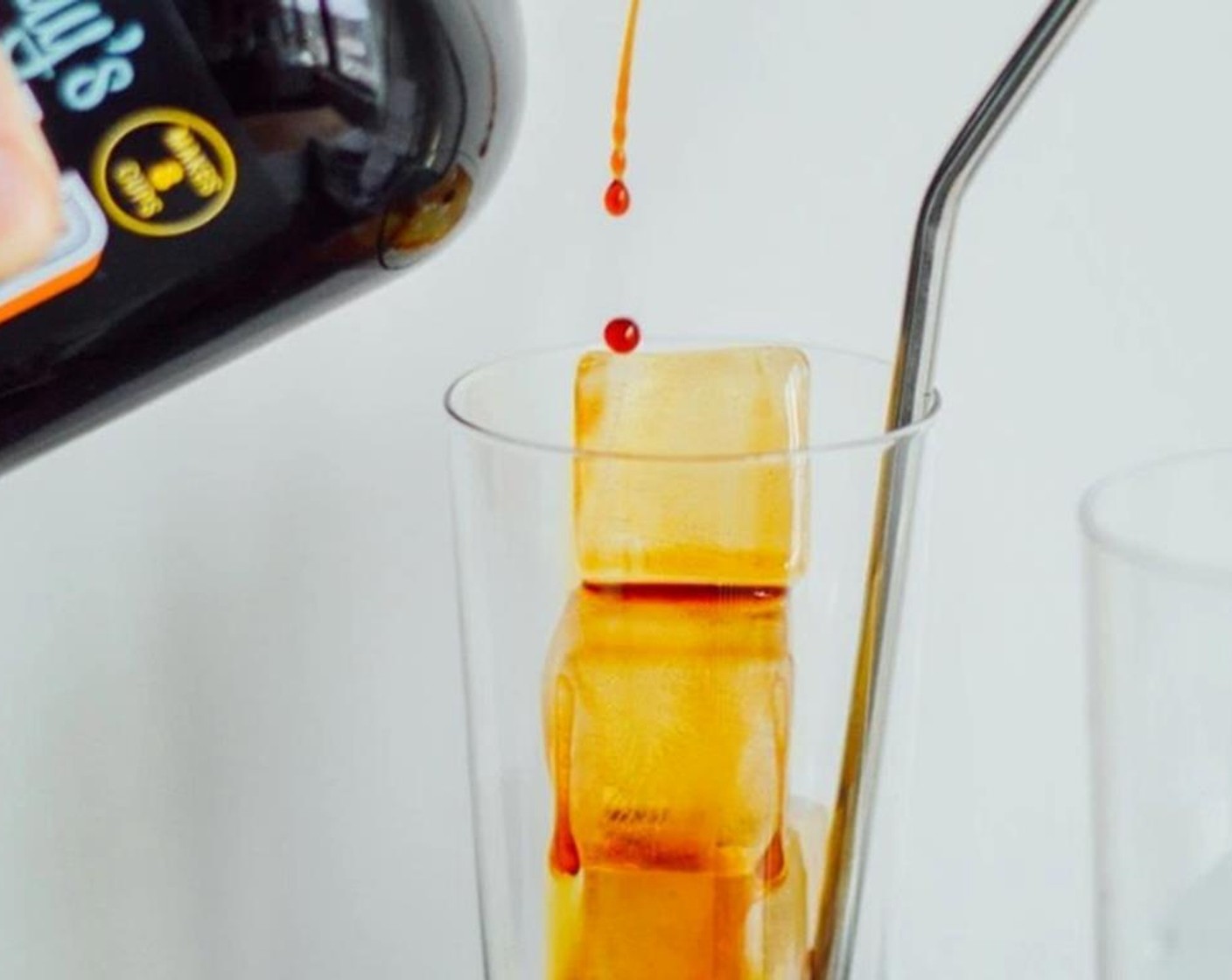 step 2 Fill the glasses with ice. Pour 1/2 cup of Cold Brew Concentrate (1 cup) in each glass.