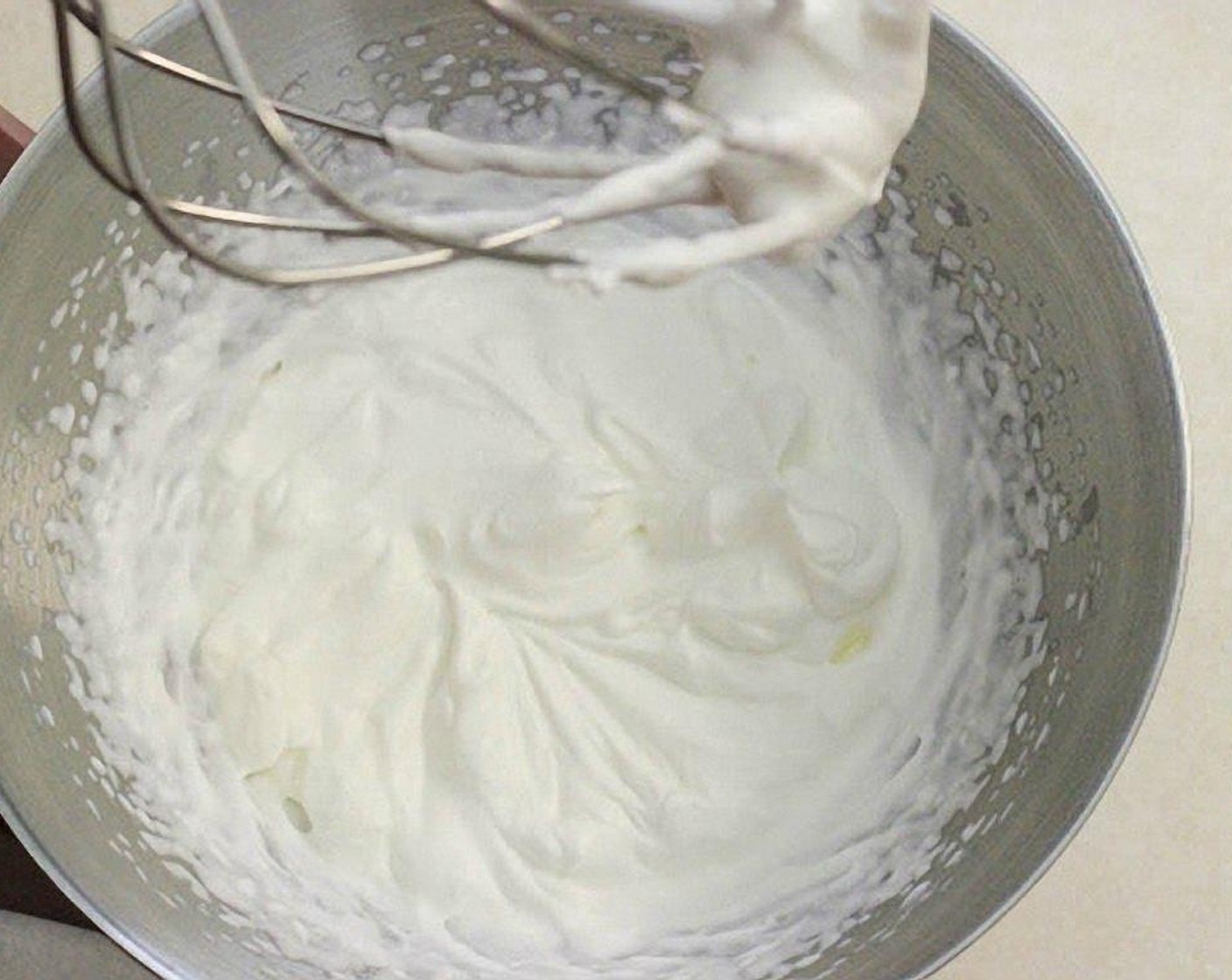 step 22 In another chilled bowl and whisk attachment, whisk the Heavy Cream (1 cup) until peaks form.