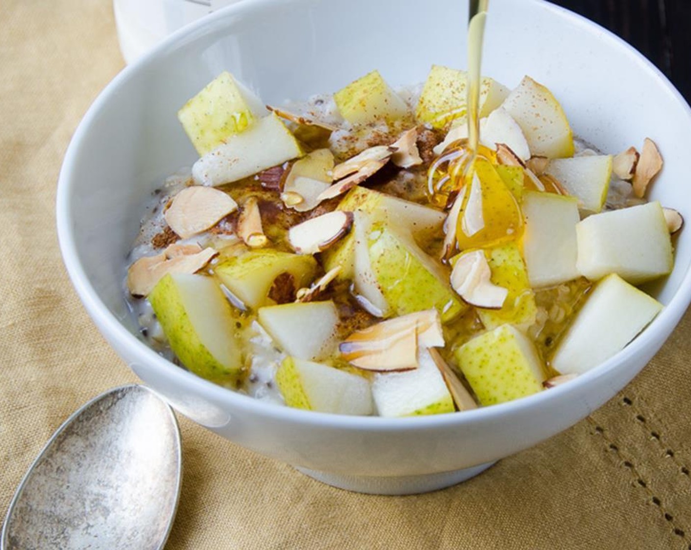 step 4 For vanilla pear almond topping: Dice the Pear (1/2). Dress your oats with Vanilla Extract (1/8 tsp), pears, Ground Cinnamon (1 dash), Honey (1 Tbsp) and toasted Almonds (1 Tbsp).