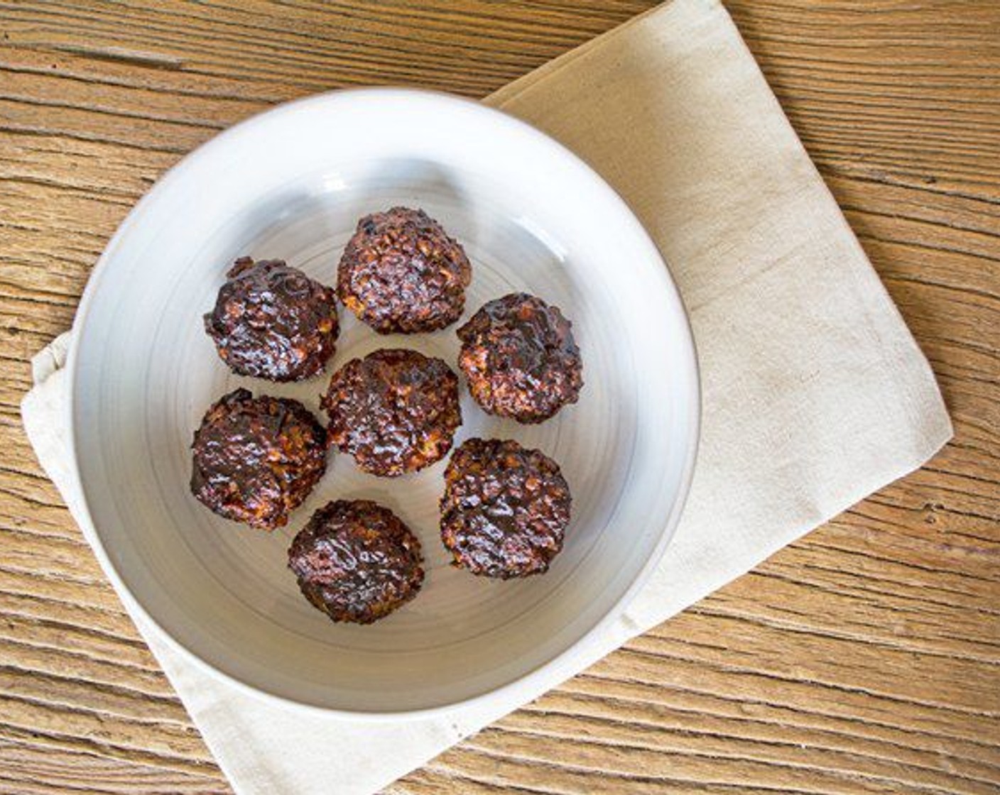 step 8 While the meatballs finish up, heat Barbecue Sauce (1/3 cup) in a small saucepan on the stovetop. Once you remove the meatballs from the oven, brush them with warm bbq sauce and serve.