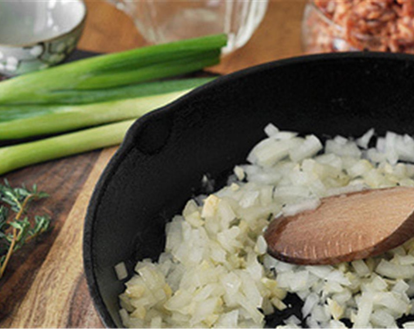 step 5 Heat a large skillet over medium-high heat. Melt in the remaining Unsalted Butter (2 Tbsp). Add the Yellow Onion (1) and Garlic (3 cloves) and allow to cook for about 5 minutes, until soft and translucent.