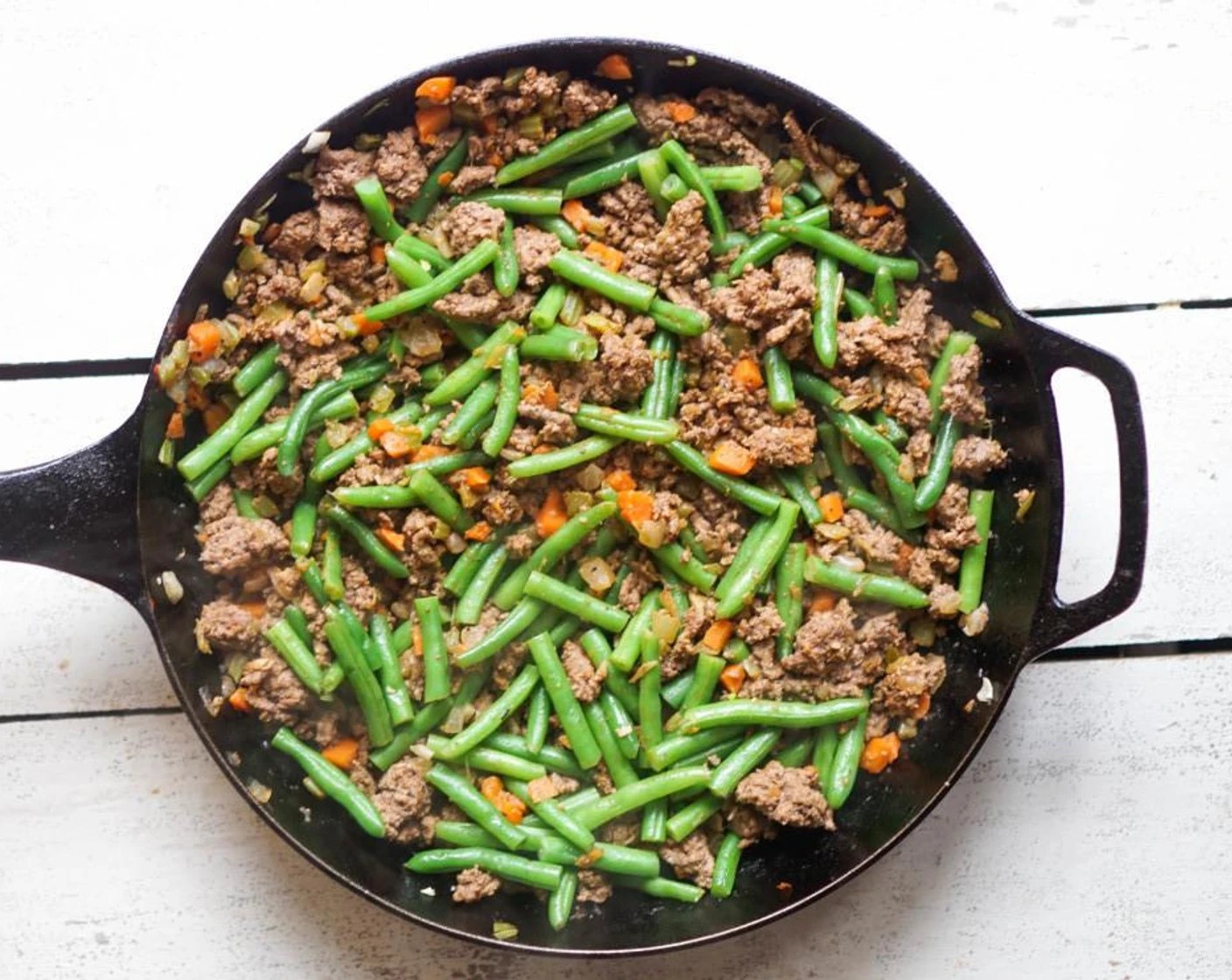 step 2 Add the Onion (1), Celery (3 stalks), and Carrots (2). Season with Salt (to taste), Ground Black Pepper (to taste), Paprika (1/2 tsp), Ground Thyme (1/4 tsp), and Crushed Red Pepper Flakes (1 pinch). Cook 4-5 minutes until the vegetables are soft and the beef is completely browned.