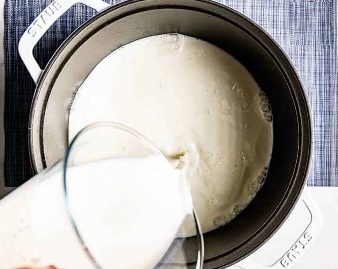 step 2 Pour the whole Milk (4 cups), Heavy Cream (2 cups), Kosher Salt (1 tsp) in a large nonreactive saucepan like a Dutch oven.